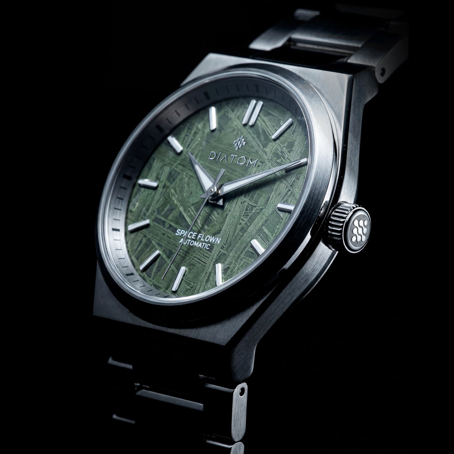 Green Meteorite watch with a metal strap