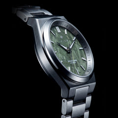 Green Meteorite watch with a metal strap