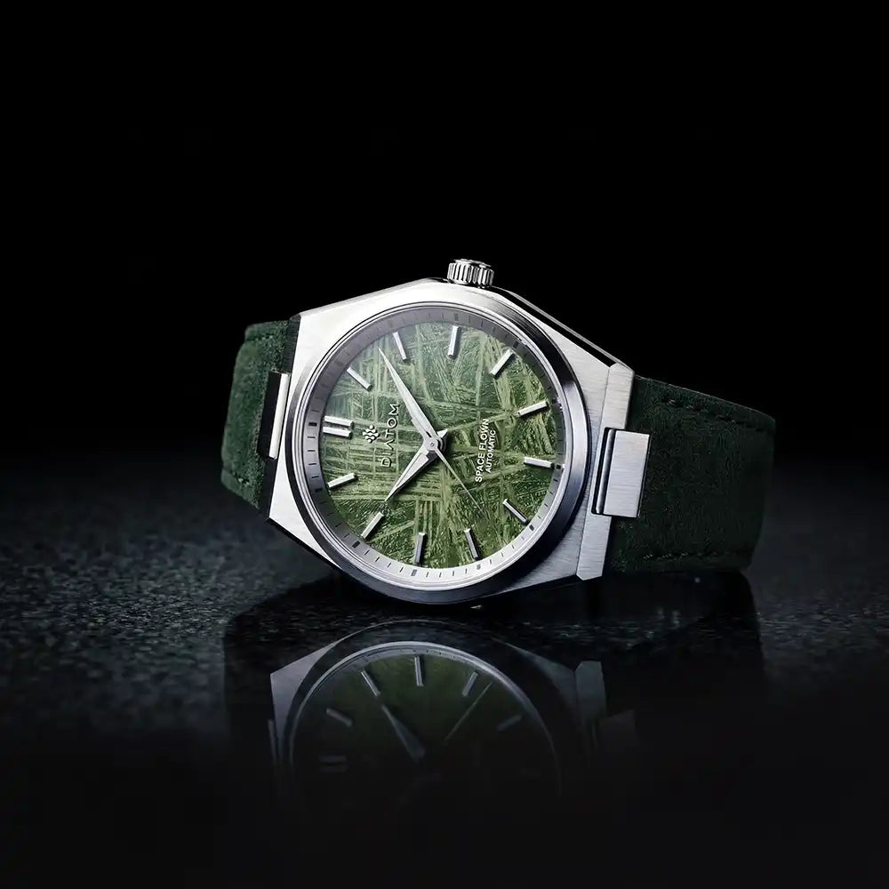 Green Meteorite watch on a flat surface