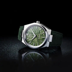 Green Meteorite watch on a flat surface